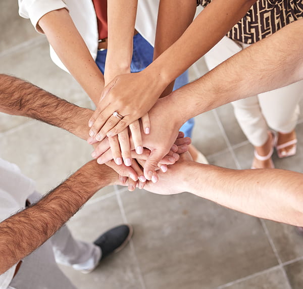 Diverse group of people having a handshake.