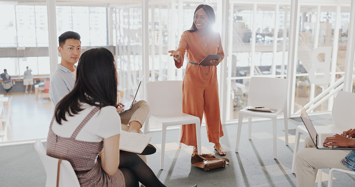 Group of people having a coaching session in the office